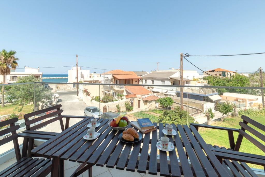 A balcony or terrace at Aria apts 100 m from the beach by PosarelliVillas
