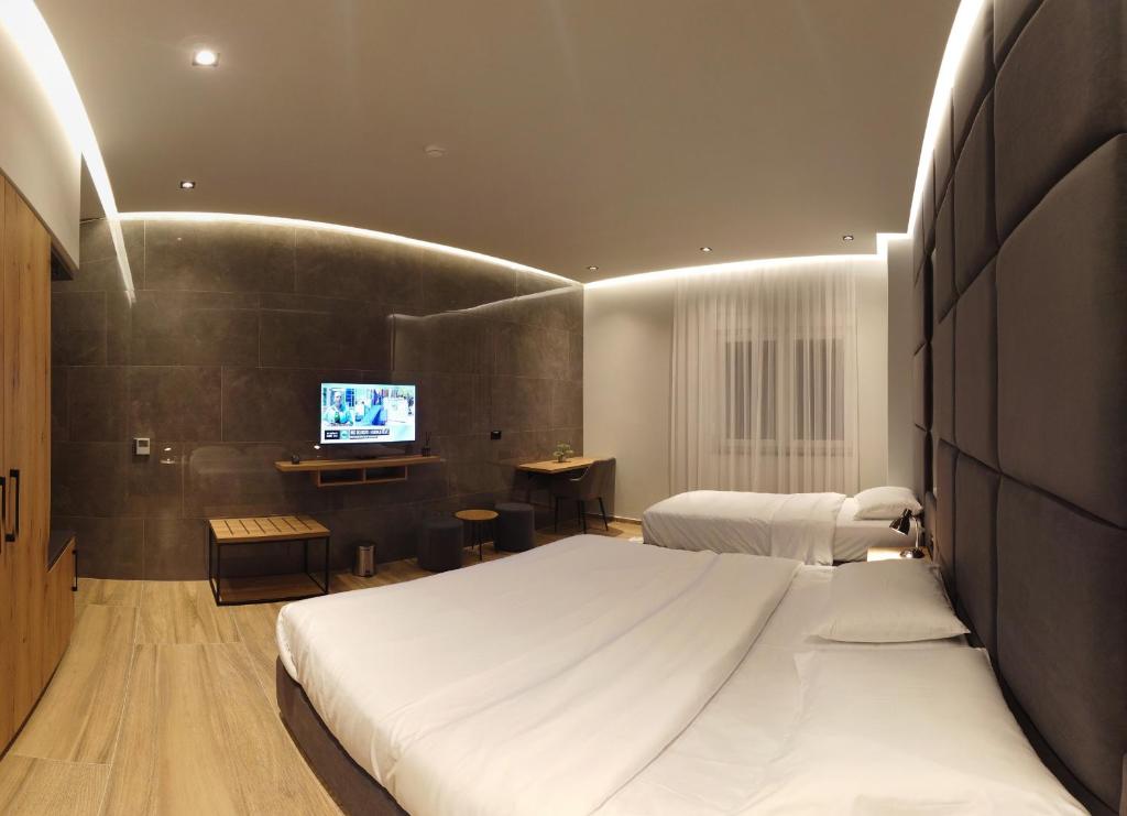 Postel nebo postele na pokoji v ubytování Hotel-VH