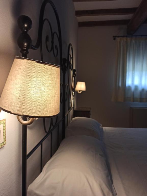 Letto o letti in una camera di Agrilocanda Val Campotto