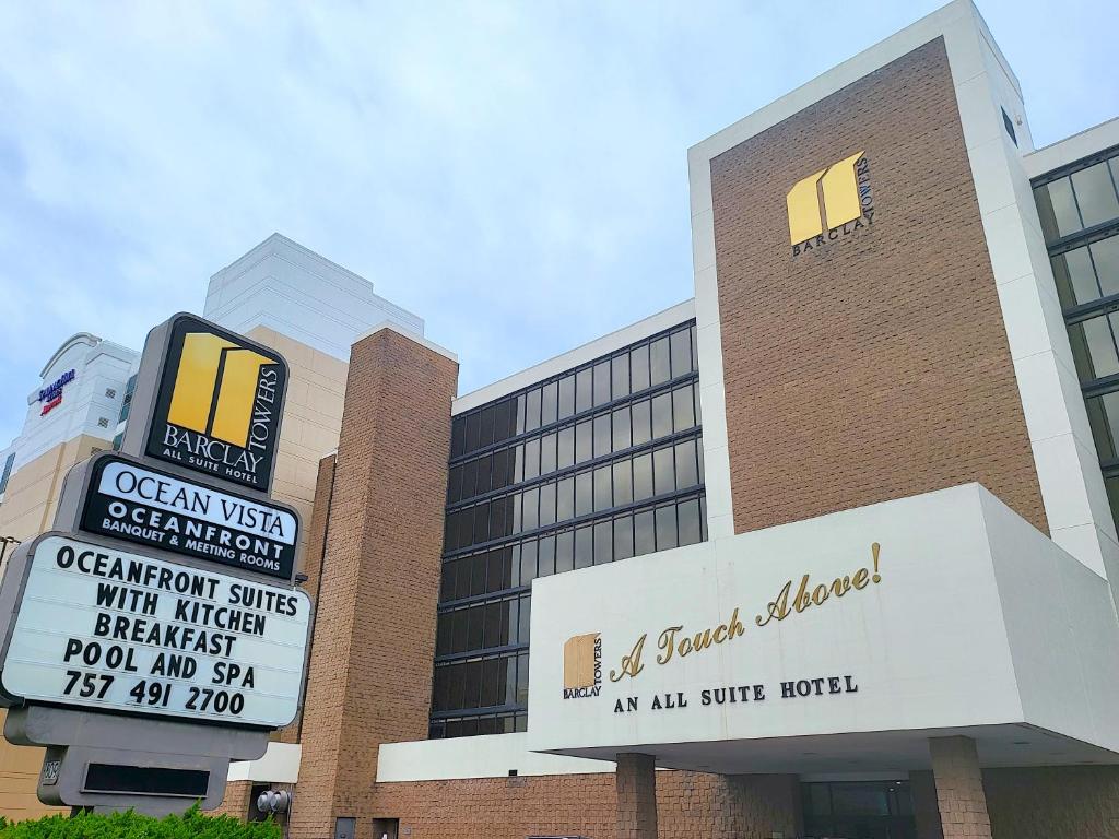 ein Gebäude mit einem Schild davor in der Unterkunft The Barclay Towers Hotel and Resort in Virginia Beach
