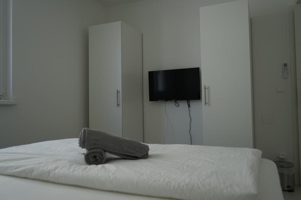 A bed or beds in a room at DM Apartment