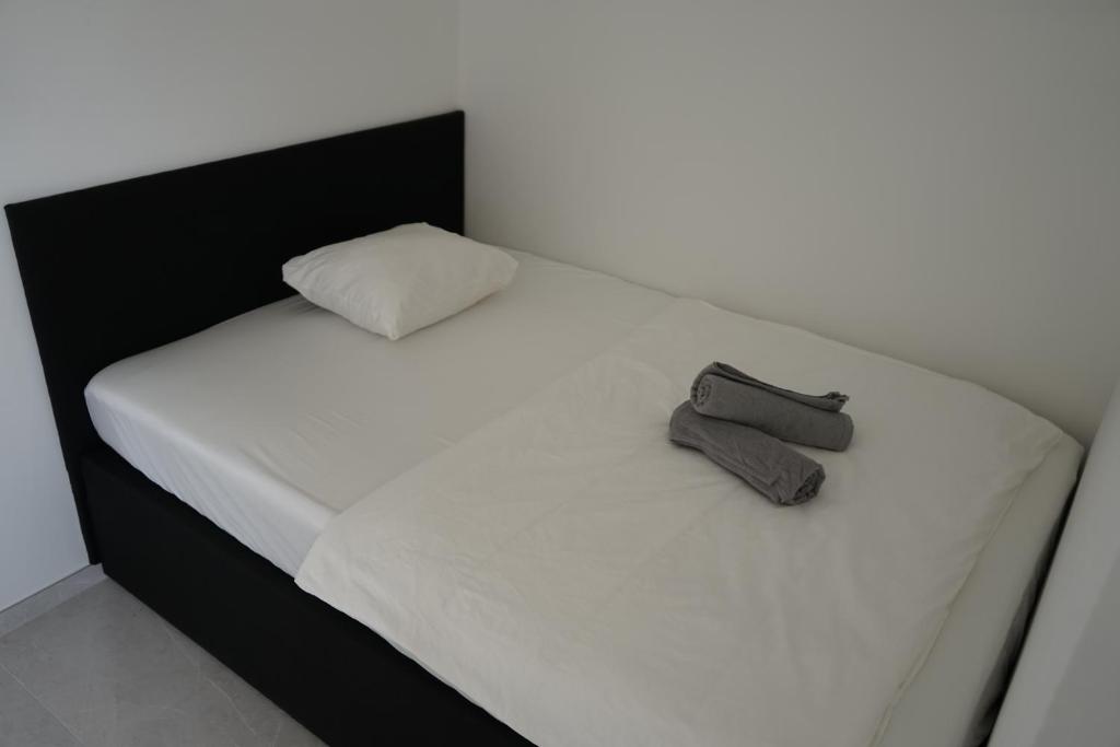 A bed or beds in a room at DM Apartment