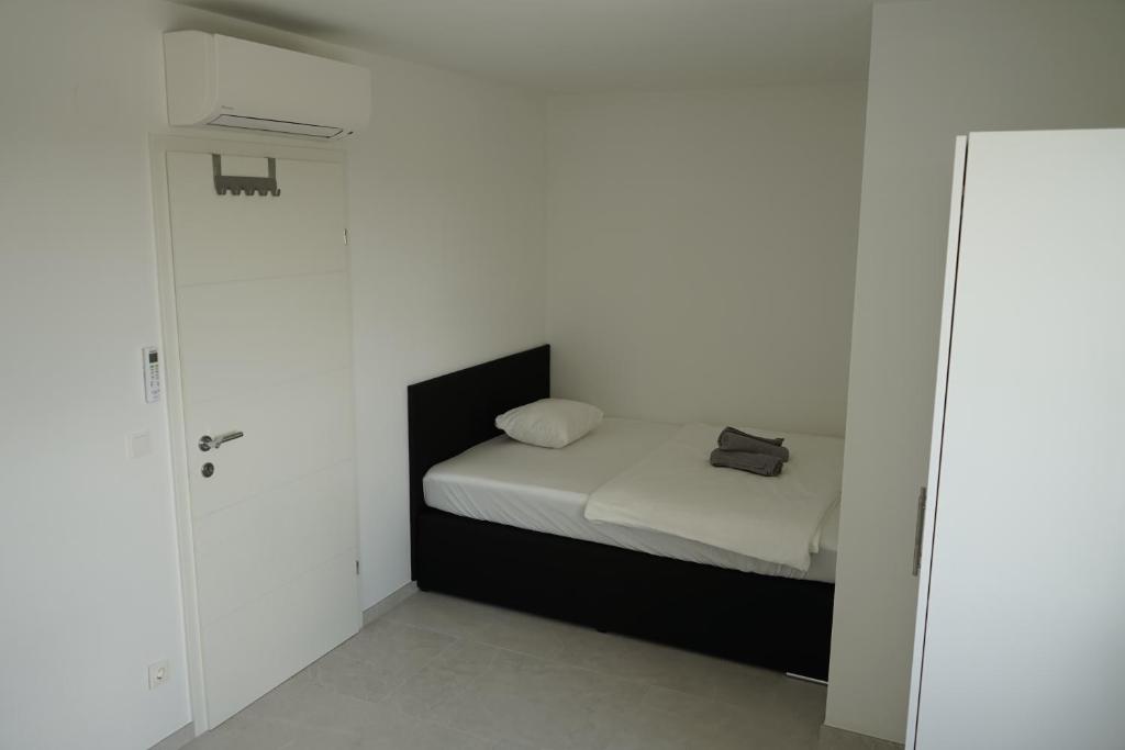 A bed or beds in a room at DM Apartment