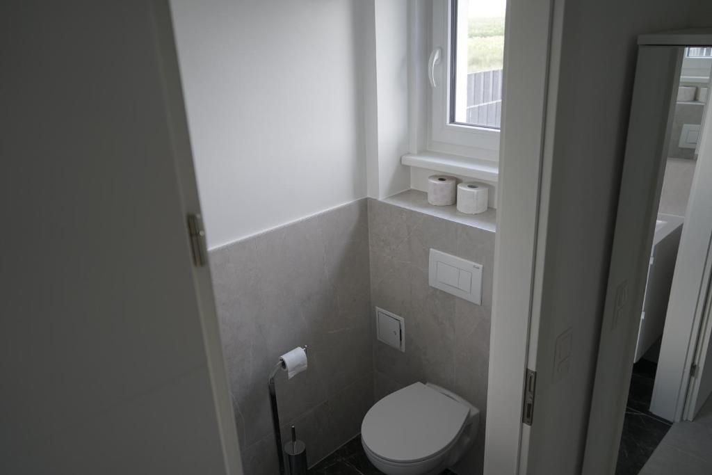 A bathroom at DM Apartment