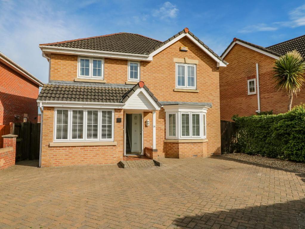 a brick house on a brick driveway at Spire Haven in Chesterfield