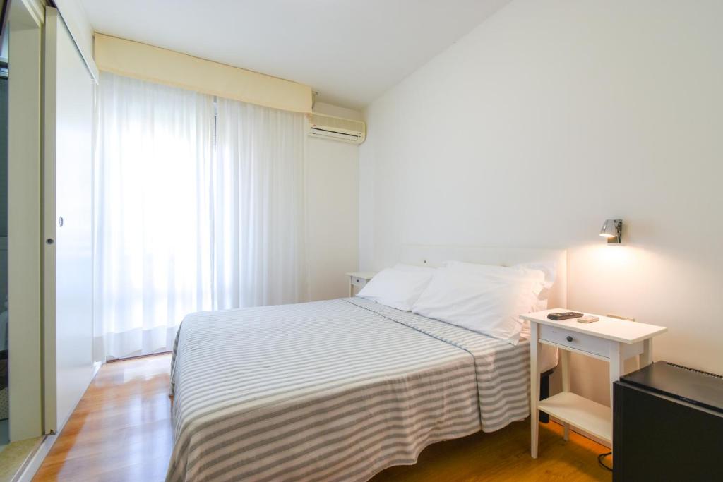 Postel nebo postele na pokoji v ubytování Hotel Janeiro