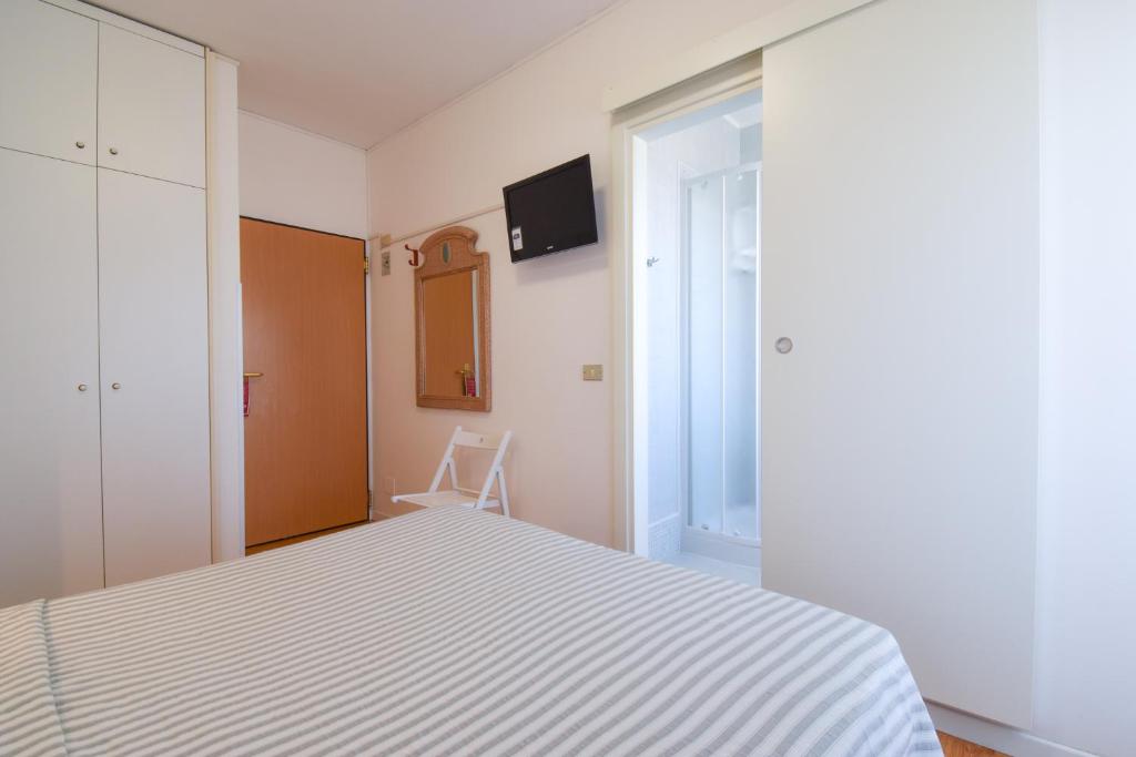 Postel nebo postele na pokoji v ubytování Hotel Janeiro
