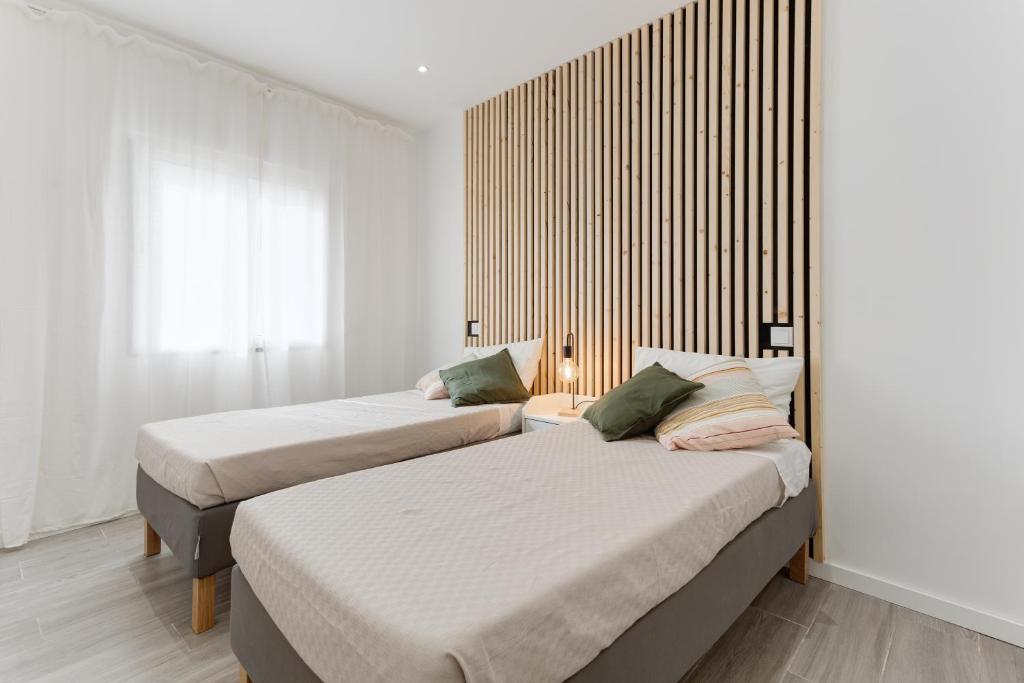 Un pat sau paturi într-o cameră la Maré Azul