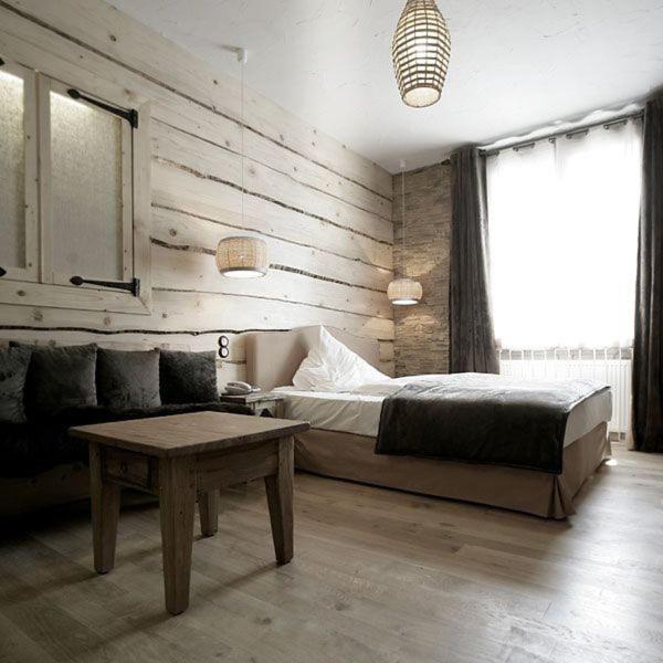 a bedroom with a bed and a coffee table at HIP Hotel in Heidelberg