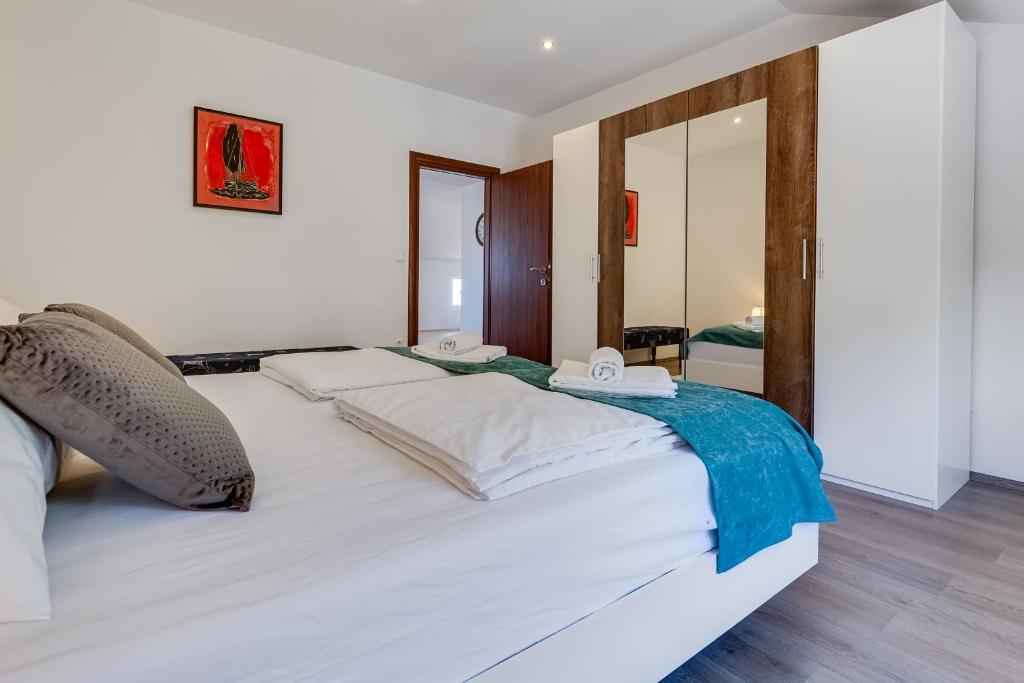 Posteľ alebo postele v izbe v ubytovaní Apartman ViEw