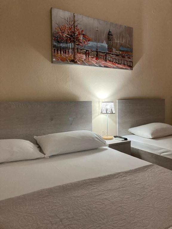 Postel nebo postele na pokoji v ubytování Hotel Medousa