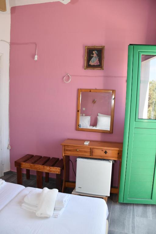 Postel nebo postele na pokoji v ubytování Metapontis Studios (Nimporio)