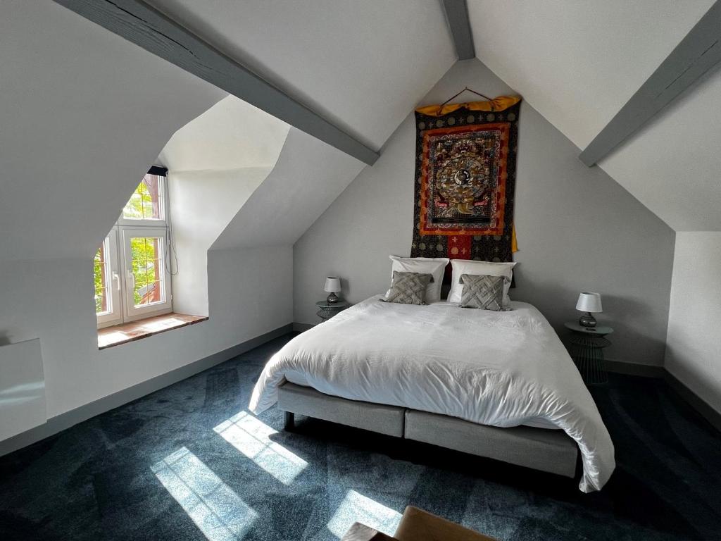 Postel nebo postele na pokoji v ubytování Le Clos des Châteaux