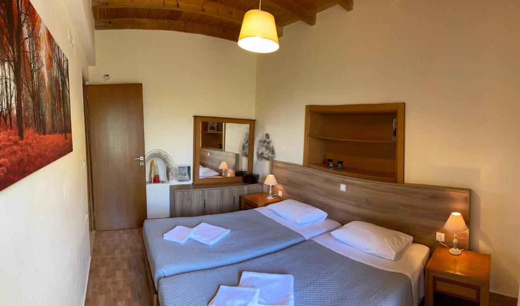 Postel nebo postele na pokoji v ubytování Koundouros Home