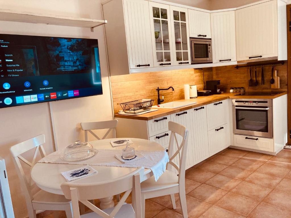 A kitchen or kitchenette at Lux House next to the Airport of Athens. Transport 24h