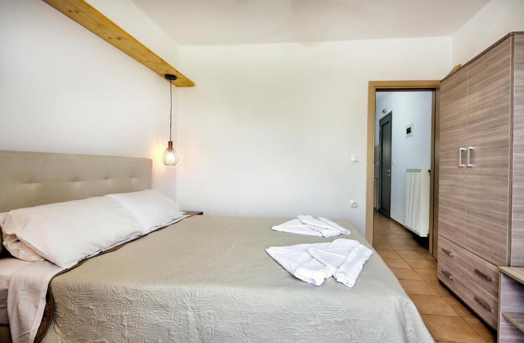 Posteľ alebo postele v izbe v ubytovaní Achilli Apartments
