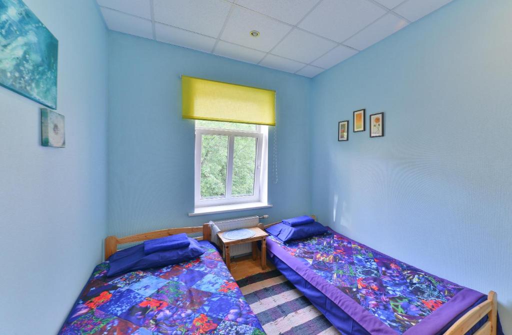 Postel nebo postele na pokoji v ubytování Central Hostel
