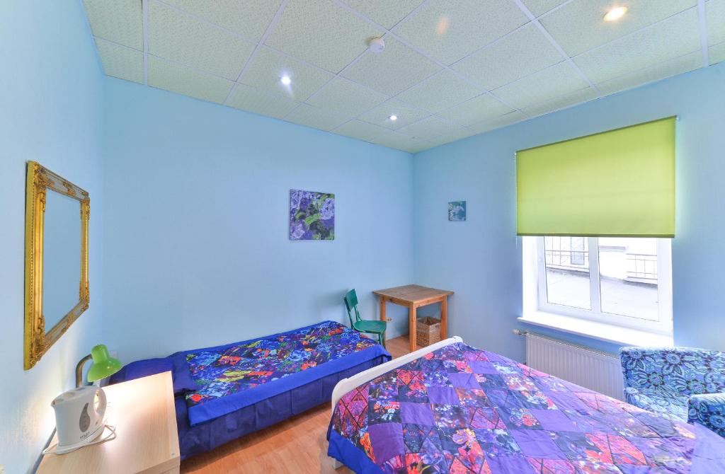 Postel nebo postele na pokoji v ubytování Central Hostel