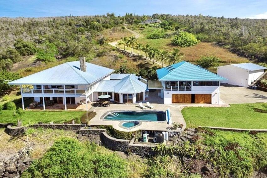 an aerial view of a house with a swimming pool at Luxe Designer Home, Best 180 Ocean View, Hot Tub & Pool estate in Papa Bay Estates