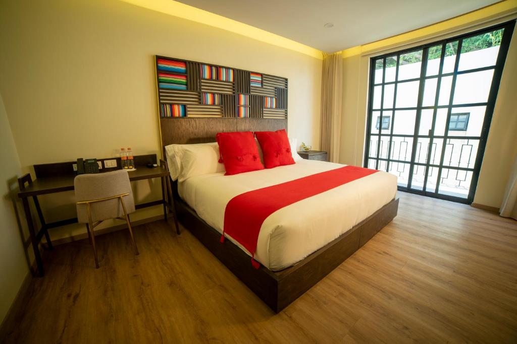 Postel nebo postele na pokoji v ubytování Hotel Dex Tlaquepaque