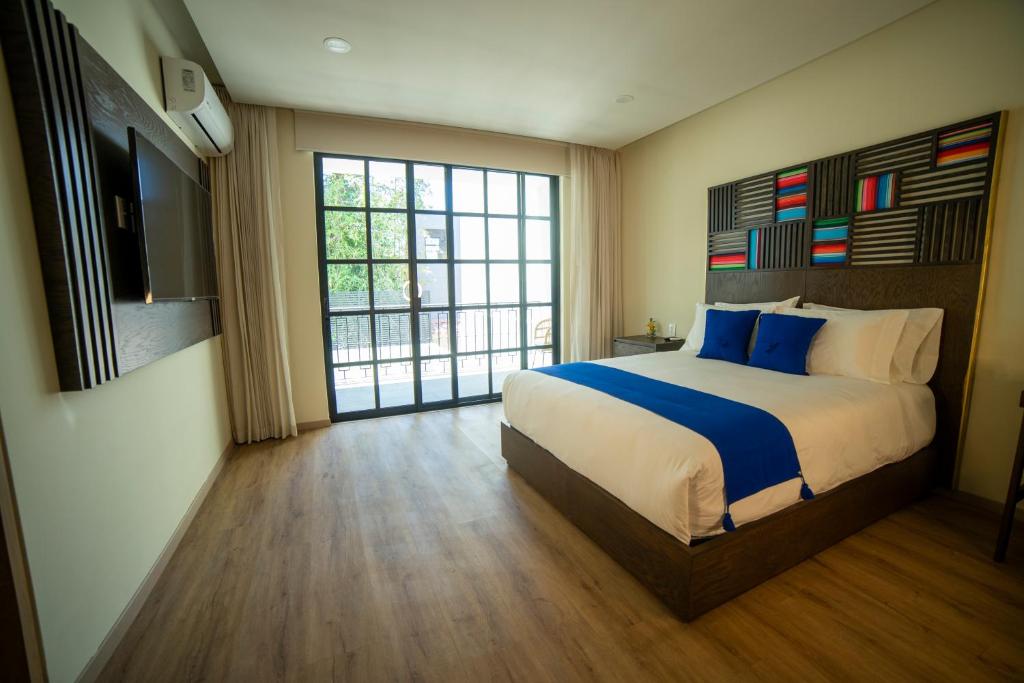 Postel nebo postele na pokoji v ubytování Hotel Dex Tlaquepaque