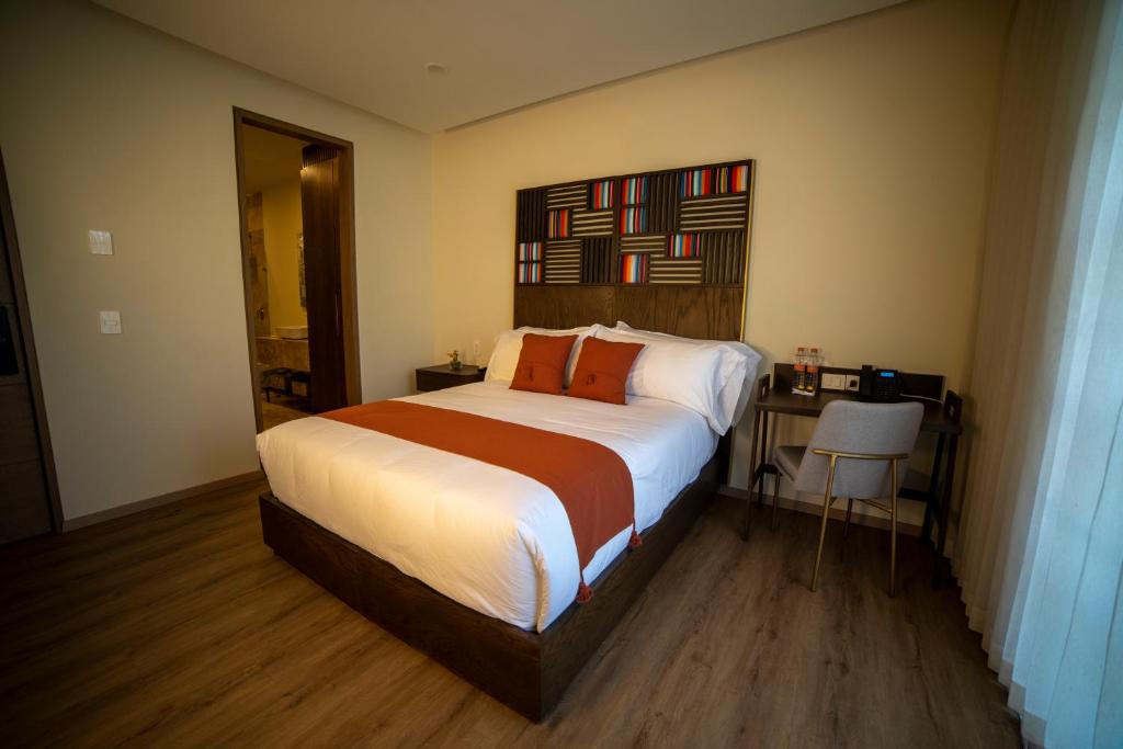Postel nebo postele na pokoji v ubytování Hotel Dex Tlaquepaque