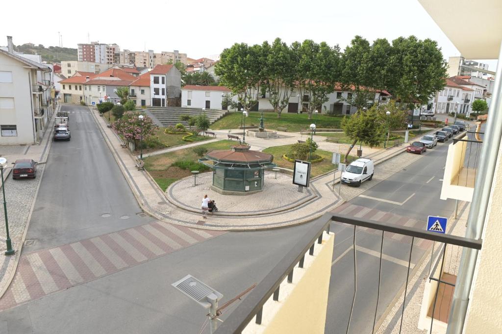 a view of a city street with a bus stop at Casa Das Eiras in Macedo de Cavaleiros