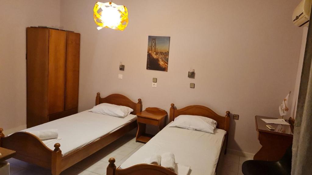 Postel nebo postele na pokoji v ubytování Garden City Image