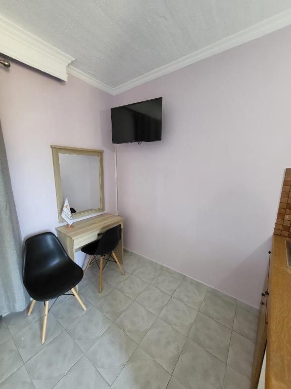 TV a/nebo společenská místnost v ubytování Garden City Image