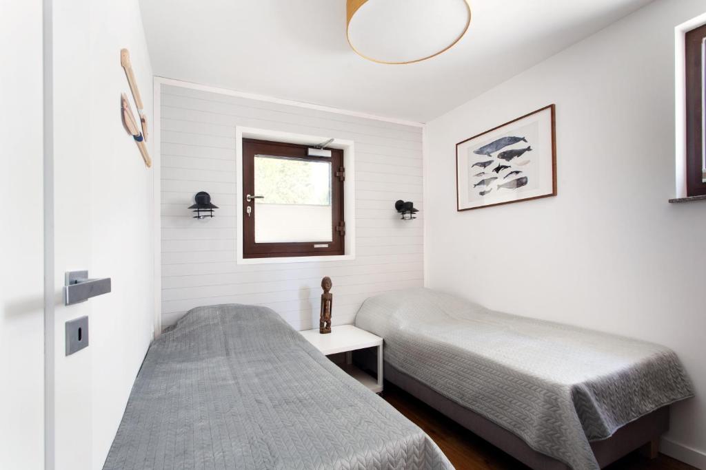 Posteľ alebo postele v izbe v ubytovaní Szumiwoda Apartamenty Kuźnica