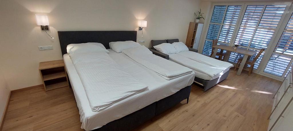 Posteľ alebo postele v izbe v ubytovaní Chill & Relax Apartments in Neusiedl am See