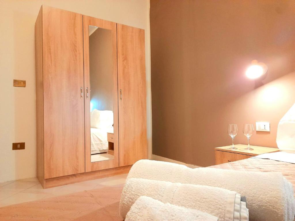 A bed or beds in a room at La Perla di Palermo