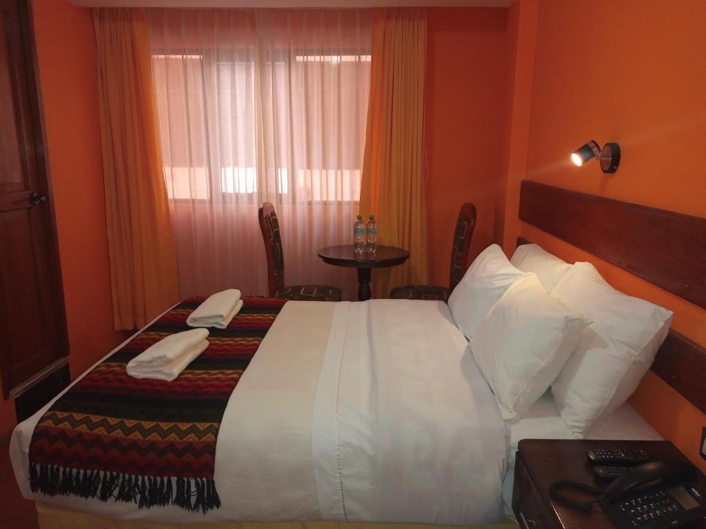Postel nebo postele na pokoji v ubytování Hotel Rio Dorado MachuPicchu