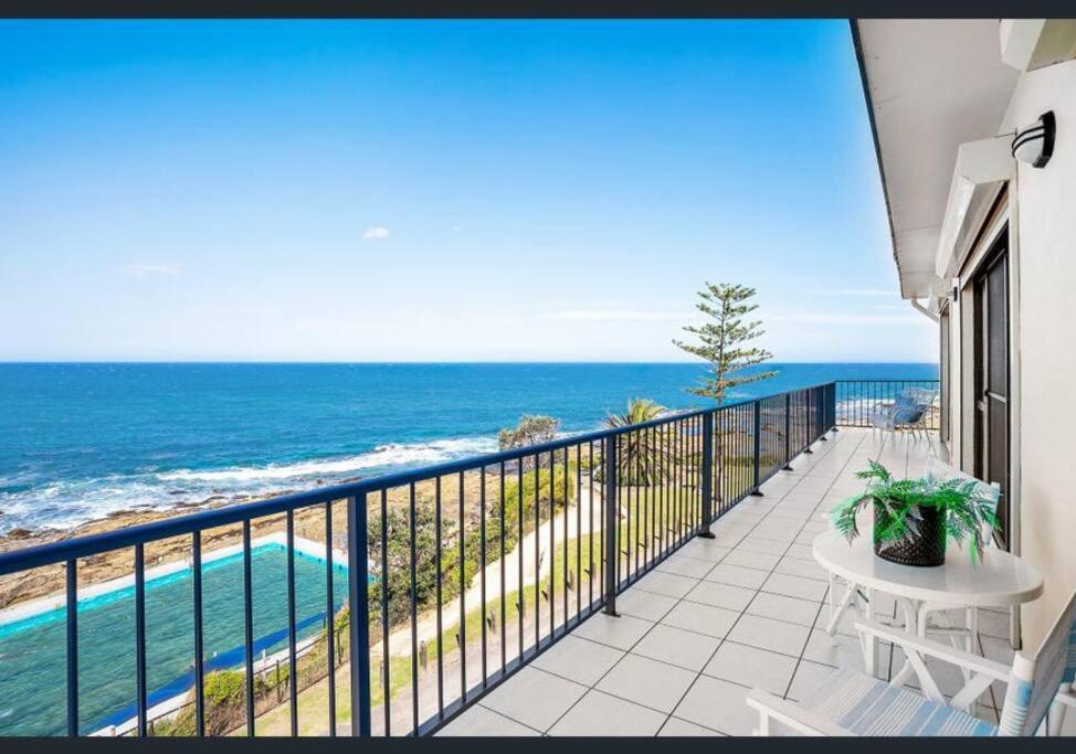 a balcony with a view of the ocean at Beachfront Penthouse at The Entrance in The Entrance