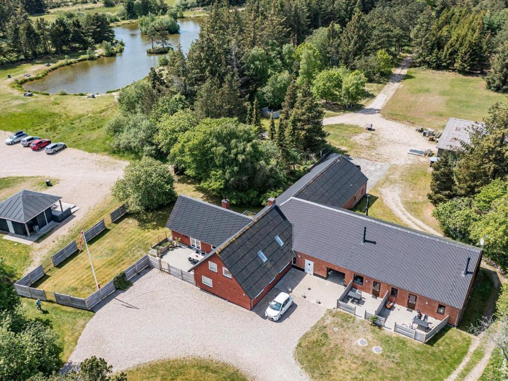 an overhead view of a large brick house with a driveway at Apartment Blåvand X in Blåvand