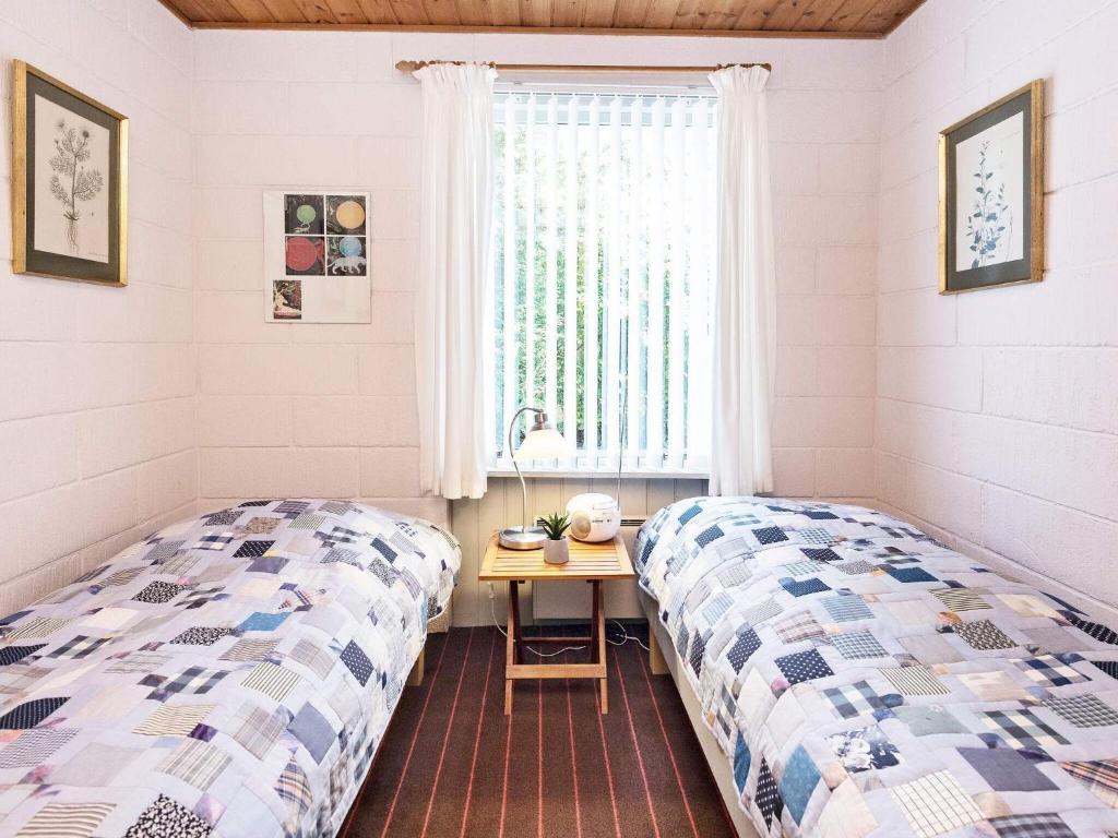 Postel nebo postele na pokoji v ubytování Three-Bedroom Holiday home in Millinge 1