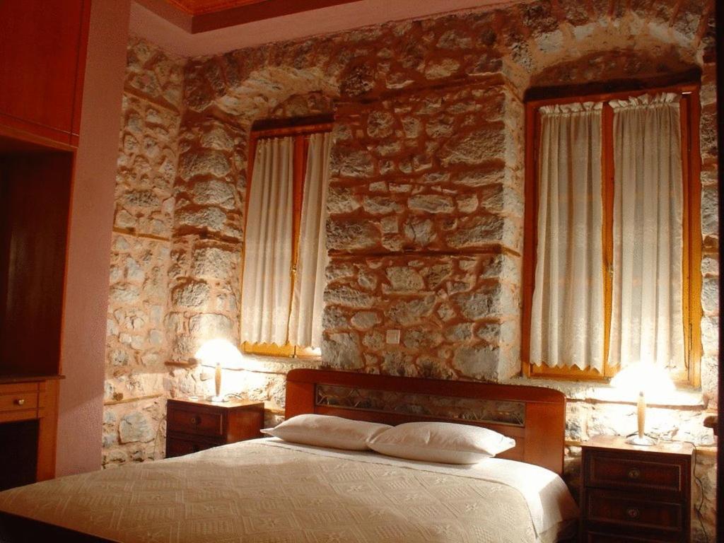 Postel nebo postele na pokoji v ubytování Ariadne Guesthouse