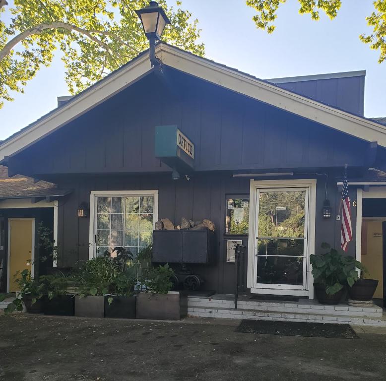 a blue building with a sign on it at The Gold Lodge in Sonora