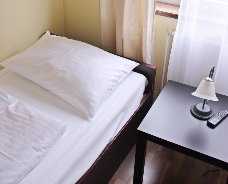 Postel nebo postele na pokoji v ubytování Hotel Hoffinger