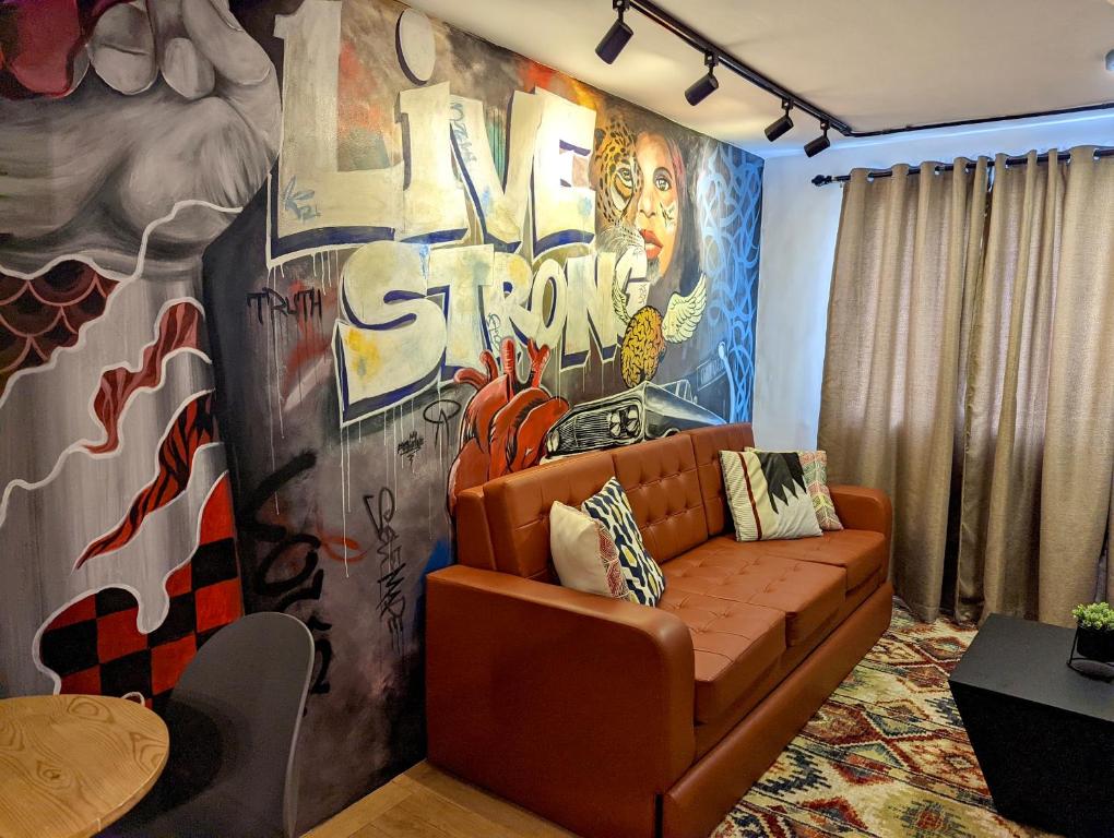 Posezení v ubytování Budget 1BR Loft Apartment in Cainta Cambridge Village