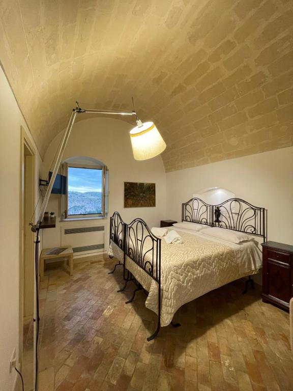 Postel nebo postele na pokoji v ubytování Dimora La Gravina