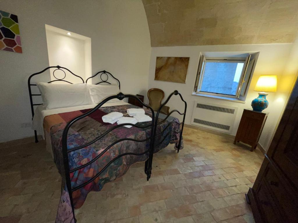 Postel nebo postele na pokoji v ubytování Dimora La Gravina