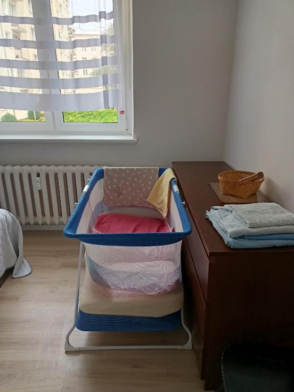 Posteľ alebo postele v izbe v ubytovaní Apartament Bursztyn