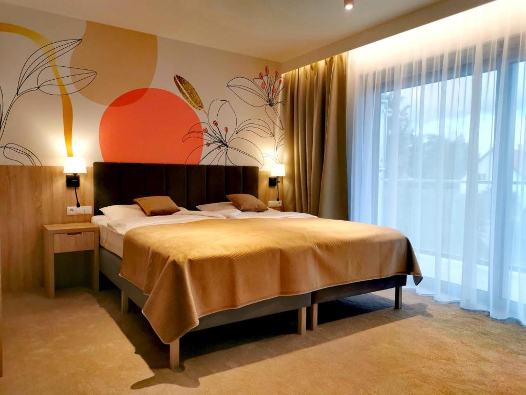 Postel nebo postele na pokoji v ubytování Hotel SKAL Medi SPA & Resort