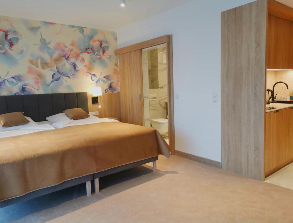 Postel nebo postele na pokoji v ubytování Hotel SKAL Medi SPA & Resort