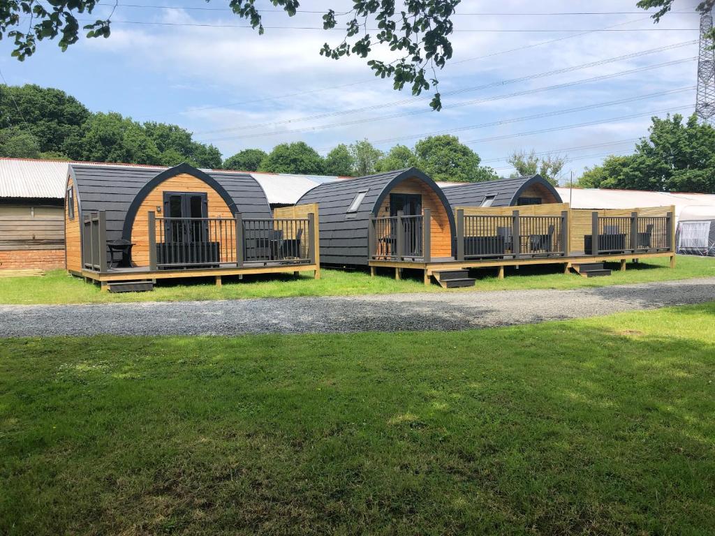a row of yurt cottages in a park at Scallow Campsite in Lewes