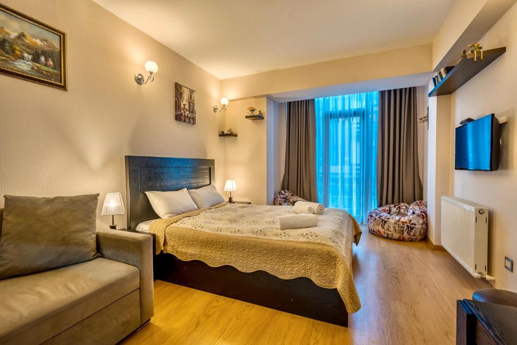 Postel nebo postele na pokoji v ubytování Studio Apartment NFT New Gudauri 215