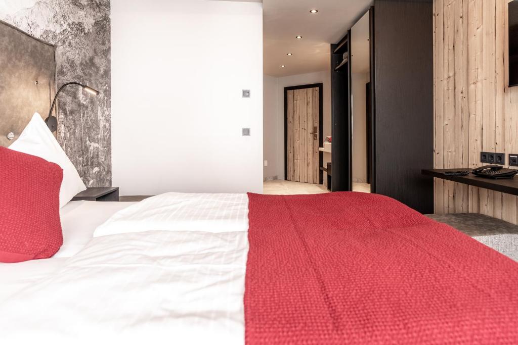 Postel nebo postele na pokoji v ubytování Hotel Astrid - inklusive kostenfreier JokerCard