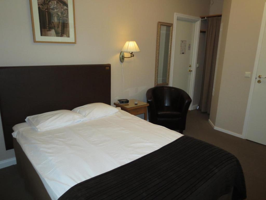 Postel nebo postele na pokoji v ubytování Hotell S:t Olof