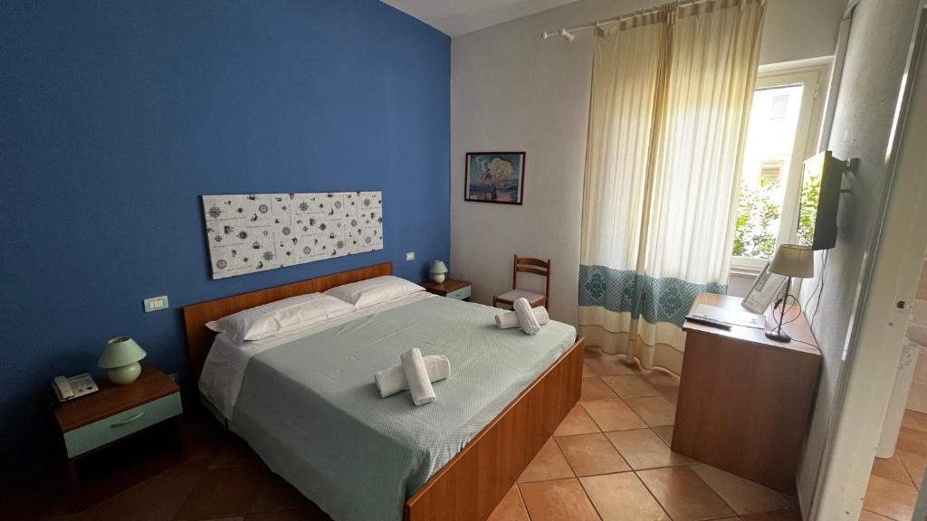 Postel nebo postele na pokoji v ubytování Hotel Frassetto
